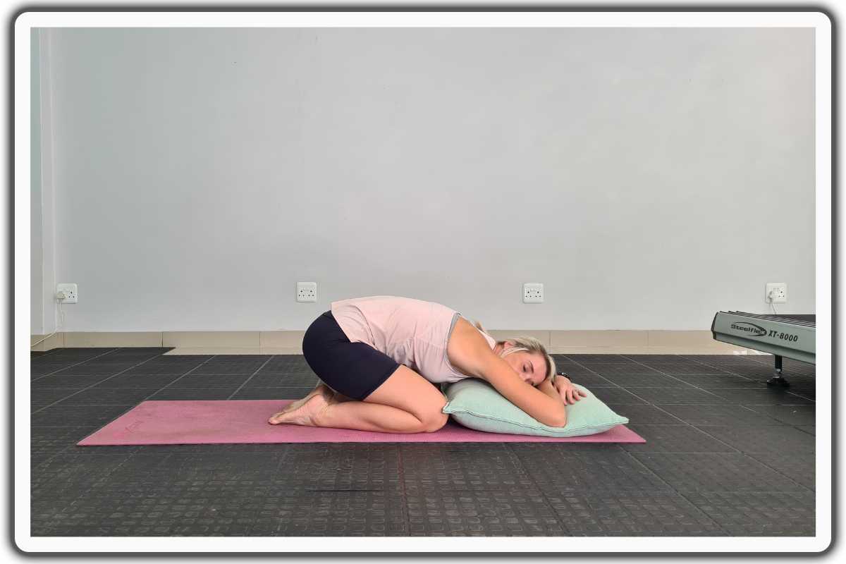 Supported Child’s Pose - heart opening yoga poses